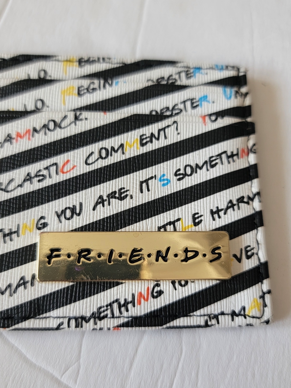 FRIENDS Striped Card Holder with Multicolor Text Accents